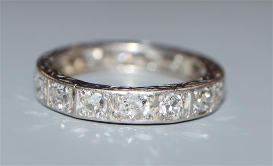 A white metal and diamond set full eternity ring, size K/L.